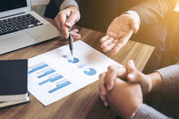 Business people are working in office, presentation in front of boss, businessman leader presentation to her colleagues and business strategy and pointing to the graph and chart Business people are working in office, presentation in front of boss, businessman leader presentation to her colleagues and business strategy and pointing to the graph and chart.